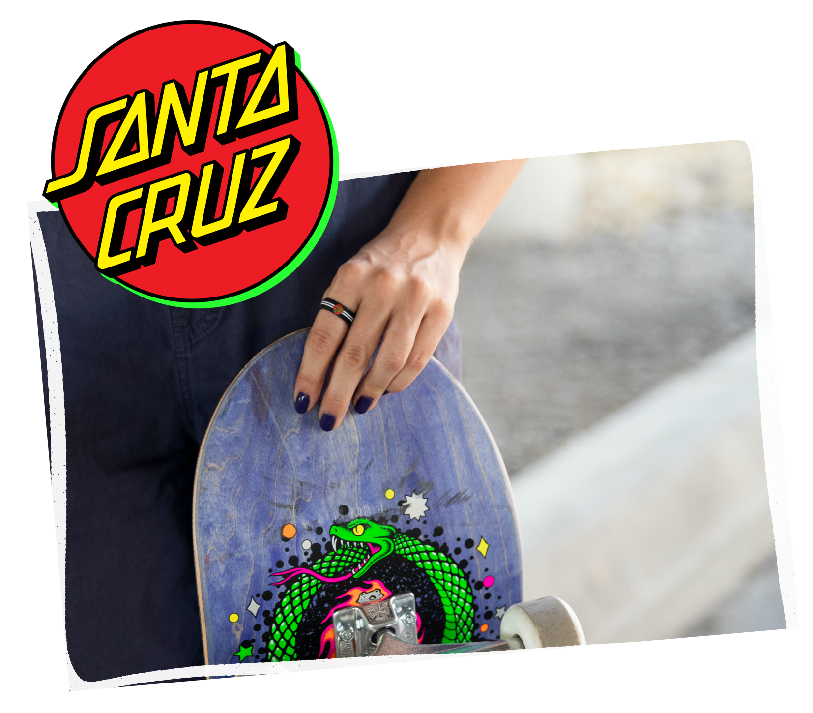Hand holding skateboard with classic dot black ring