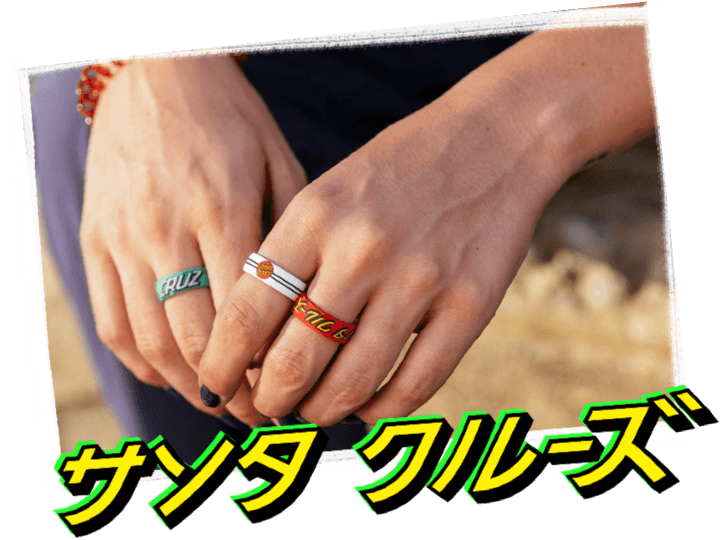 Hand holding skateboard with classic dot black ring
