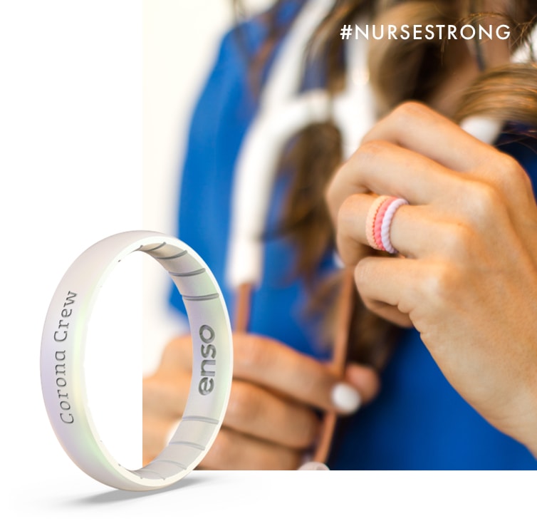 Close up image of a nurse's hand wearing 3 Enso Braided Stackable rings